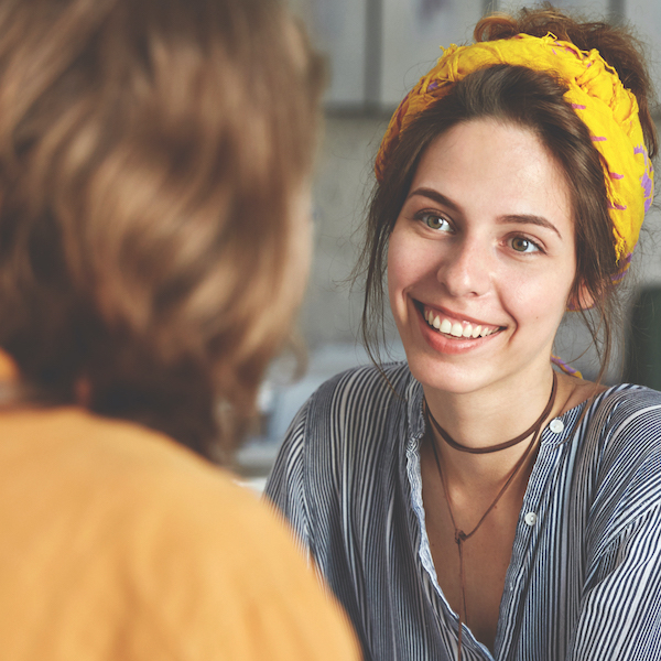 Female doctor smiling at patient during consultation